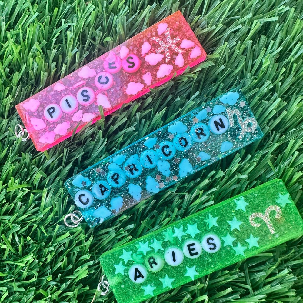 Zodiac Sign Keychains in Pink, Blue, and Green